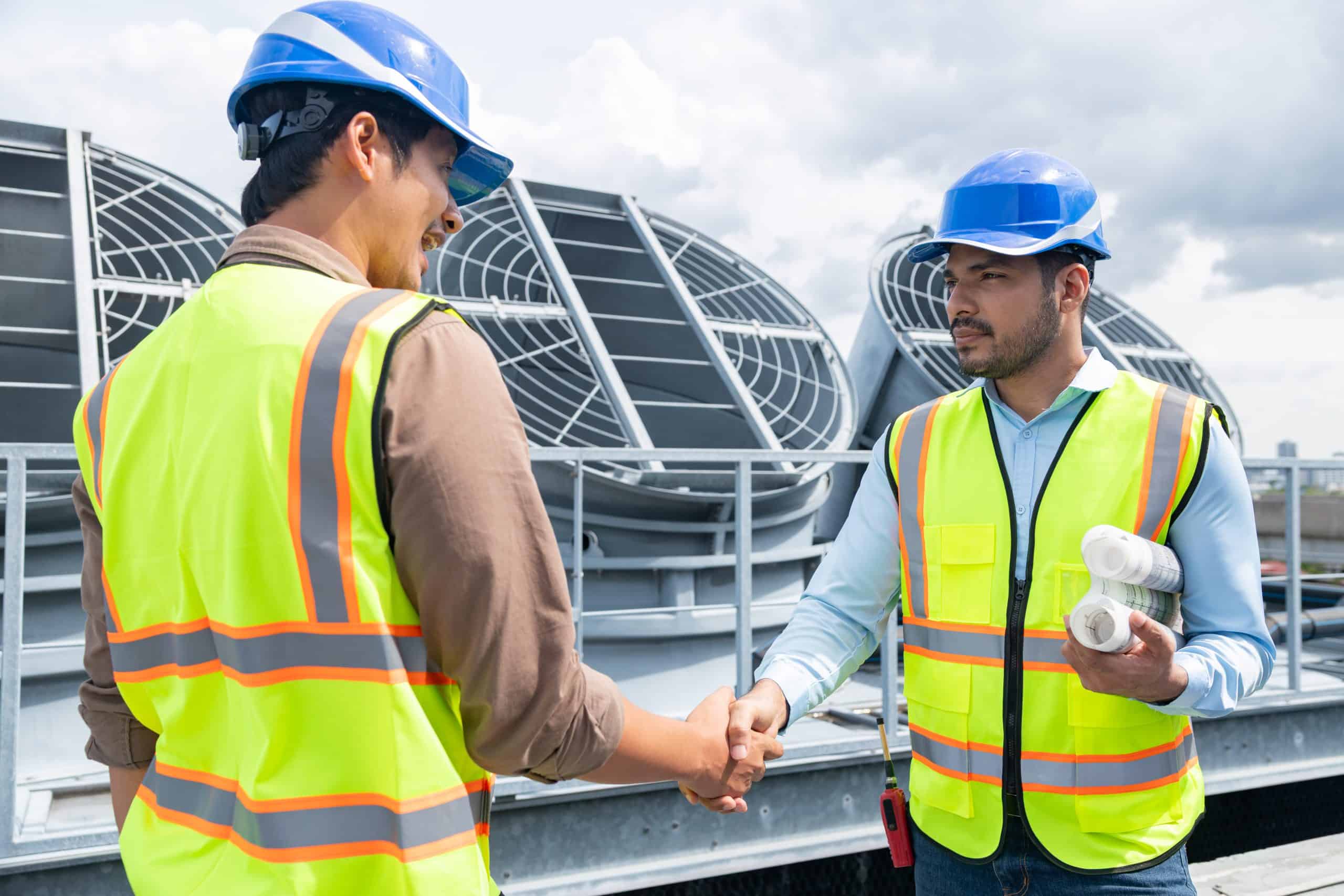 Home Engineers handshake on rooftop